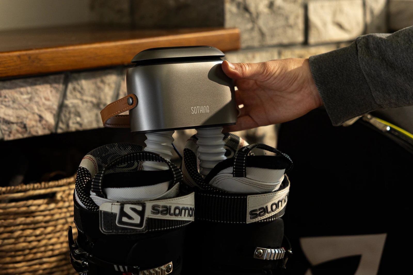 Ultra Grey positioned above open ski boots